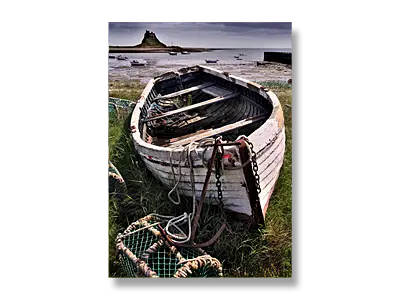 An old fishing boat, lobster pots, and Lindisfarne Castle, - Holy Island (Lindisfarne), Northumberland - Click to view or buy this customisable greeting card
